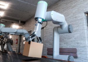 Industrial robotic arm lifting a brown cardboard box onto a conveyor belt in a modern facility